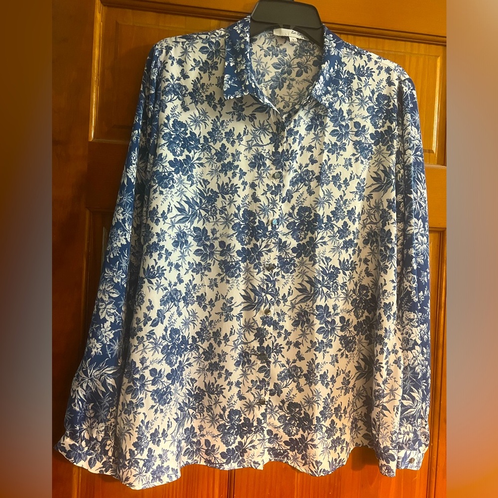 A beautiful button-up blouse to dress up or go casual. Navy & white floral.